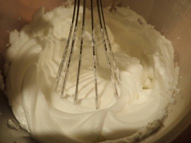 egg white batter in a bowl with mixer
