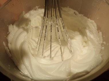 egg white batter in a bowl with mixer