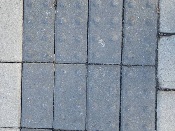 detail of a street concrete cobble tiles  pattern