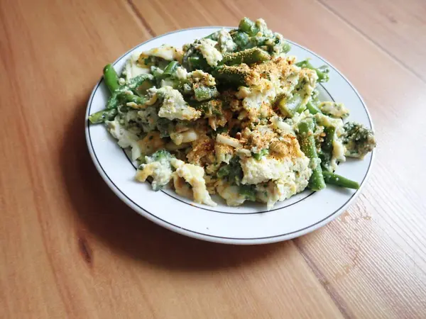 stock image warm vegetable salad served on a plate on the table