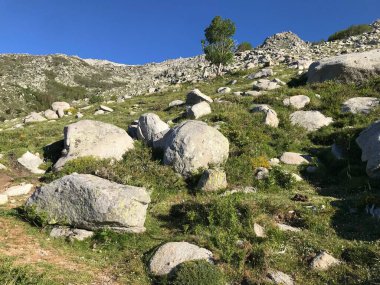 hiking the beautiful challenging GR20 trail in corsica island france clipart