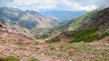 challenging hiking the GR20 trail corsica island france clipart