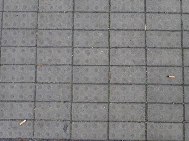Yürüme yolundaki gri şehir kaldırım kiremitleri dokusu