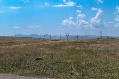 wild mountain meadow in armenia in summer clipart