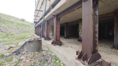 old abandoned meteorogical station in armenia mountains by kari lich lake clipart