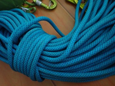 folded blue rope for sport rock climbing clipart