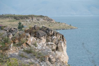 beautiful rocky shore of sevan lake in arnenia clipart