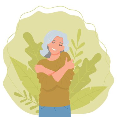 Yaşlı kadın kendini kucaklıyor.