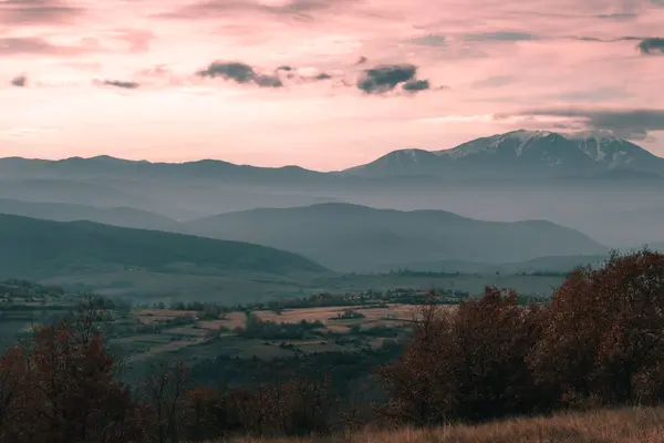 Magical scenery landscape view of the Pirin Mountains in Bulgaria with a lot of layers covered in fog.