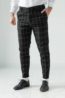 Bulgaristan - 03 19 2024: Beyaz çizgili erkekler için siyah pantolon. Modelleme.