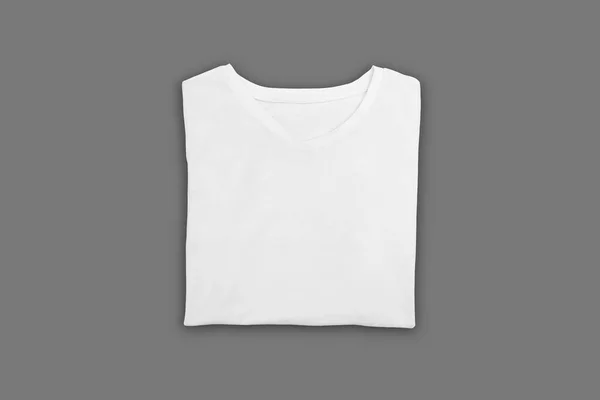 Camiseta Plegada Blanca Sobre Fondo Gris —  Fotos de Stock