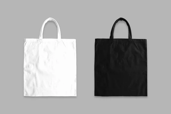 白い背景に生地のトートバッグモックアップ 黒と白の布のキャンバスバッグモックアップ 正面図 廃棄物ゼロ 環境に優しいコンセプト 3Dレンダリング — ストック写真