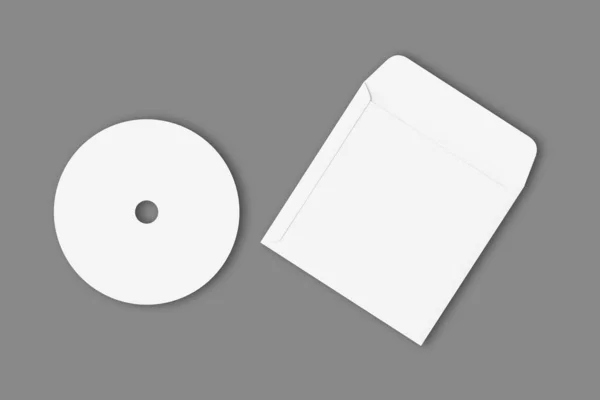 カバーが付いている空白の白いコンパクト ディスクはテンプレートを分離しました 3Dレンダリングをモックします — ストック写真
