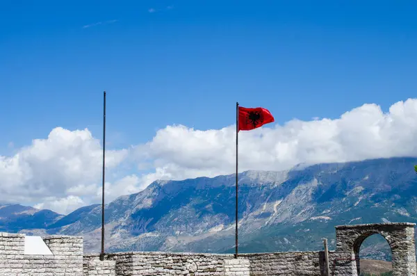 stock image Old stone wall with albanian flag in Gjirokaster, Albania, stock photo.