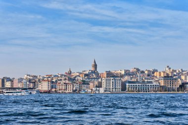 Istanbul, Turkey - December 17 2022: Karakoy waterfront cityscape with Galata Tower. Ancient Turkish landmark in Beyoglu district, European side of the city