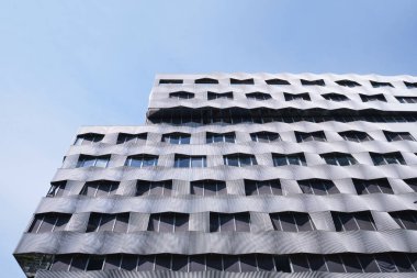 Paris, France - May, 2022: Oscillating facade of office block Be Open, home of the Metropole du Grand Paris, stands in the 13th arrondissement, Quai d'Austerlitz
