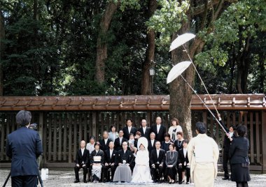 Tokyo, Japan - Sept, 2017:  A Japanese traditional wedding ceremony in Shinto style held at Meiji Jingu shrine. A formal family photo session is taking place