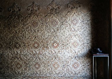 Tokyo, Japan - Sept, 2017: Rustic mosaic wall pattern with light and shadow and telephone National museum of tokyo