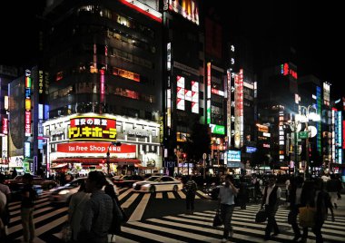 Tokyo, Japan - Sept, 2017:  Kabukicho crossing, red-light and nightlife entertainment district, Shinjuku crowded with tourists during the night with neon billboard and advertisements in background