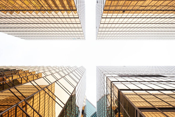 Hong Kong, China - April 28 2023: Symmetrical Golden Exterior facade Design of Office Buildings