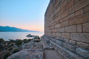Bafa, Turkey - July 15, 2023: The ruins of ancient city of Herakleia and Latmos Athena temple located on the shore of Lake Bafa clipart