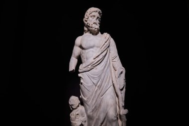 Istanbul, Turkey - September 16 2023:Marble statue of the Greek God of Health Asclepius in Istanbul Archaeological Museums. Dates from 2nd century CE found in Miletus Ancient City clipart