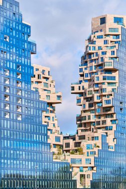 Netherlands, Amsterdam - April 7, 2024: Iconic residential towers known as The Valley at Amsterdam Zuidas district, designed by MVRDV clipart