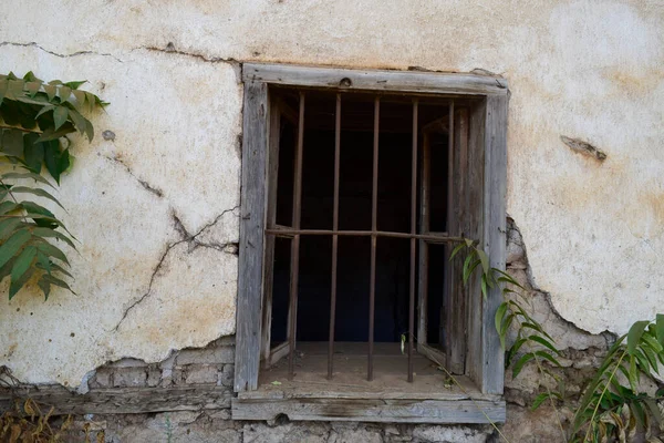 old wooden window in the stone wall