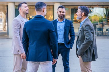 A group of business professionals engaged in a serious discussion outdoors. They are dressed in formal and smart casual attire, with a modern cityscape in the background. clipart