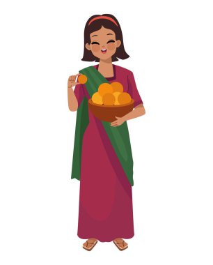 Hintli kadın laddu ile Diwali festivalini kutluyor.