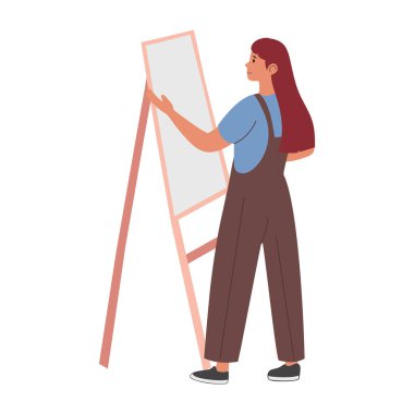 Resim öğretmeni sehpada resim yapıyor.