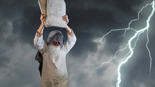 The Old Testament biblical prophet Moses holds the tablets with the ten commandments