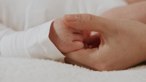 Close Footage Mother Holding Baby Newborn Hand — Stock Video