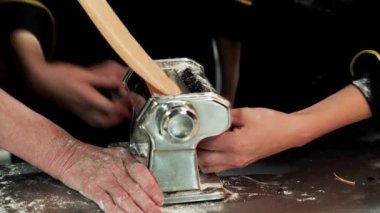 Footage of chef stretching dough for ravioli.