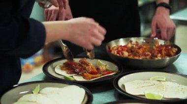 Close up video of chef preparing mexican burrito food.