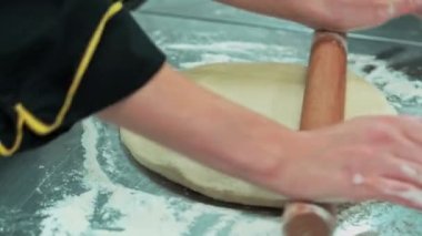 Close up footage of chef preparing dough for donuts.