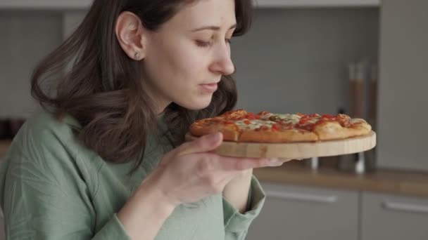 Close Video Young Woman Smelling Fresh Baked Pizza Mozzarella — Stockvideo