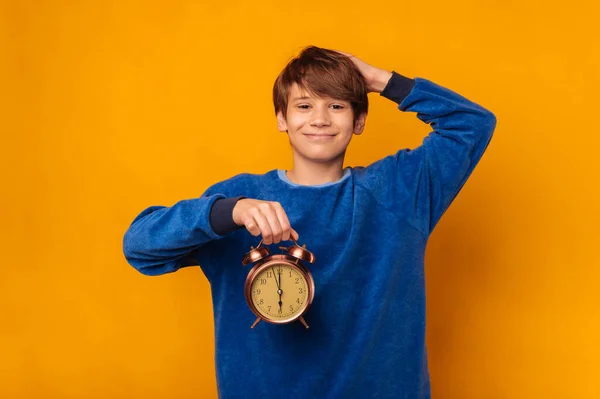 Cheerful Smiling Teen Boy Holding Alarm Clock Hand His Head — ストック写真