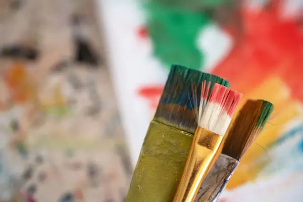 painting lessons, canvas with paints, brushes and other elements for painting