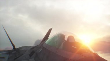 Askeri savaş uçağı F-22 bulutların üzerinde uçuyor. Hava Kuvvetleri