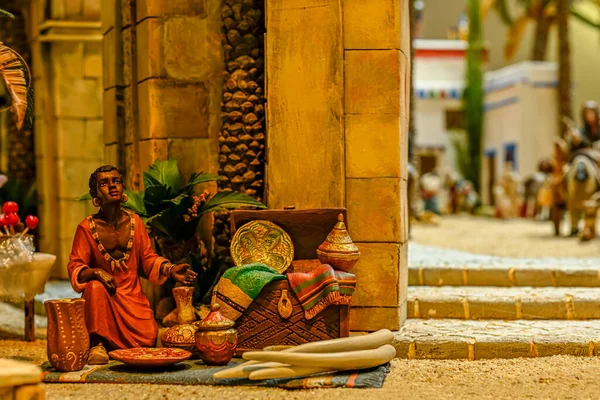 Street market of a colored man, in a portal of Belen