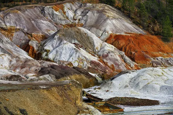 stock image A striking landscape of multicolored geological formations at the Rio Tinto mines, marked by the passage of time and extraction