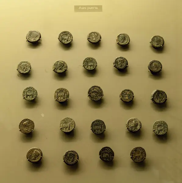 stock image Exhibit featuring ancient Roman Ases coins with a door design. Showcasing intricate details and historical significance, these coins are perfect for numismatic enthusiasts and history lovers.