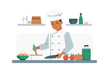 Profesyonel aşçı mutfakta taze sebzeler, mutfak gereçleri ve aletlerle yemek hazırlıyor..