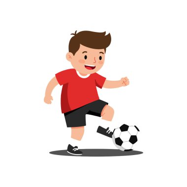Çocuk duruş pozisyonundan futbol topuna neşe ve enerjiyle vurmaya geçiyor..