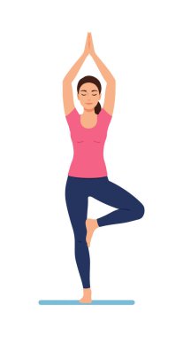 Kadın ağaç yogasında dengede duruyor. Pembe bluz ve mavi pantolon giyiyor. Arka planda durgun bir hava var..