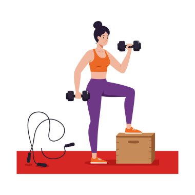 Bir kadın spor sahnesinde kırmızı paspasın yanında halatla dambılları tutarak egzersiz yapıyor..