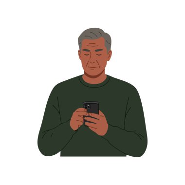 Resimde, orta yaşlı, gri saçlı, akıllı telefon kullanan, yeşil kazak giyen sakin ve odaklanmış bir ruh hali sergileyen bir adam görülüyor..