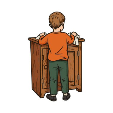 Çocuk ahşap dolabın karşısında duruyor ve iki elinde de günlük kıyafetlerle elbiseyi temizliyor. Sahne sakin ve odaklı..