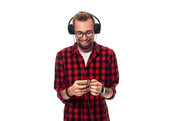 Young Hipster Man Checkered Shirt Glasses Wearing Earphones Looking Happy — Stock Photo, Image